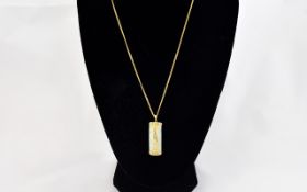 A 9ct Gold Mounted Jade Pendant with Attached 9ct Gold Long Chain, The Jade Overlaid In Gold Chinese