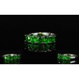 Russian Chrome Diopside Band Ring, a row of five oval cut chrome diopsides, totalling 2cts, from