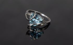 Sky Blue Topaz Caged Trillion Solitaire Ring, a trillion cut, sparkling blue topaz of 4cts appearing