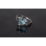 Sky Blue Topaz Caged Trillion Solitaire Ring, a trillion cut, sparkling blue topaz of 4cts appearing