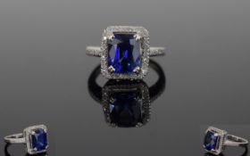 14ct White Gold Sapphire & Diamond Ring, Set With A Central Emerald Cut Sapphire (Estimated Weight