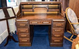 Antique Roll Top Writing Desk Circa 1920's Fashioned in dark oak with lovely aged patina.