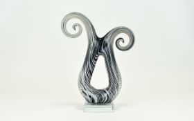 A Murano Style Striated Scroll Form Glas