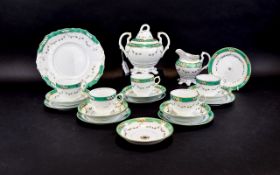 Part Teaset green, white and gold pattern. Includes 6 cups and saucers, 6 side plates, oval dish,