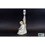 Lladro Lamp Base A charming lamp base in the form of a young girl in nightdress reading a book