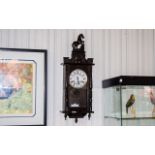 Late 19th/Early 20th Century Wall Clock, spring driven movement and pendulum. Horse finial.