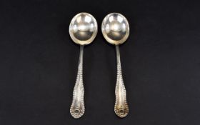George V Period Pair of Solid Silver Soup Spoons shaped handles with beaded borders. Hallmark