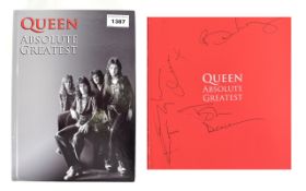 Queen Autographs in Book 'Absolute Greatest' by Brian May, John Deacon, Roger Taylor.