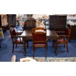 Dark Oak Extending Dining Table And Six Chairs Of plain form with dark, aged patina. Matching chairs