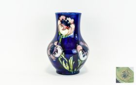 Moorcroft Tubelined and Impressive Bulbous Vase 'Big Poppy' design on blue ground. label to base.