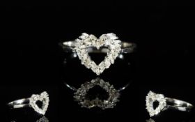 Diamond Heart Ring, a cluster of baguette cut diamonds, totalling .25ct, cleverly set in the