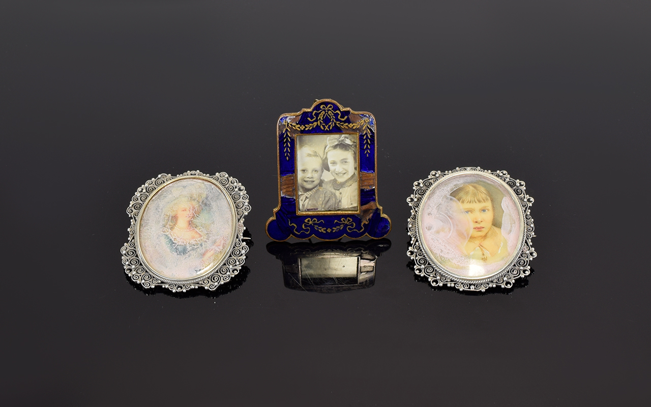 A Fine Pair of Ornate Silver Framed Portrait Pendant Brooches. Marked 800 Silver. Each 2 Inches High