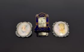 A Fine Pair of Ornate Silver Framed Portrait Pendant Brooches. Marked 800 Silver. Each 2 Inches High