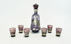 Amethyst Glass Decanter Set comprising decanter and 6 shot glasses.