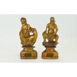 A Pair of 19th Century Soapstone Figures of Male Tribal Chiefs, Sitting and Holding Large Leaves