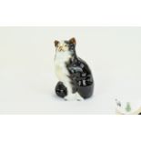 Royal Doulton Black And White Persian Seated Cat Figure HN 999 - style one. Artists initials JS to