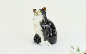 Royal Doulton Black And White Persian Seated Cat Figure HN 999 - style one. Artists initials JS to