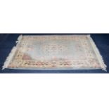 Oriental Style Rug Heavy wool/poly blend medium sized rectangular rug, the field a pale duck egg