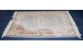 Oriental Style Rug Heavy wool/poly blend medium sized rectangular rug, the field a pale duck egg