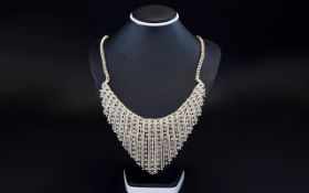 White Crystal Waterfall Necklace, the centre front with a shaped, flexible piece covered with