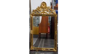 Large Ornate Reproduction Mirror Rococo style bevelled glass mirror in yellow gilt decorative