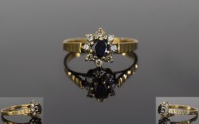 Ladies 9ct Gold Set Diamond and Sapphire Cluster Ring. Flower head Setting. The Central Sapphire
