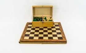 Wooden Chess Set and Board. Green and Cream Chess Pieces housed in a wooden case. Good Condition.