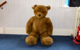 Giant Seated Plush Teddy Bear Large pale brown fur bear toy, with glass eyes. A statement piece