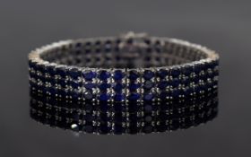 Deep Blue Sapphire Three Row Tennis Bracelet, 34cts of oval cut sapphires set in three matching rows