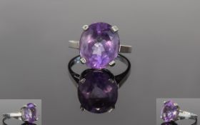A Vintage Silver And Amethyst Dress Ring An attractive ring with faceted oval stone in raised claw