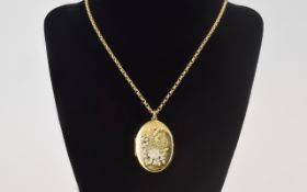 Vintage 9ct Gold Oval Shaped Locket with attached 9ct gold belcher chain both fully hallmarked for