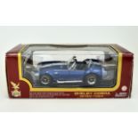 A 1964 Navy and White Shelby Cobra 427S/C Car Model. Made of Die Cast Metal With Some Plastic Parts.