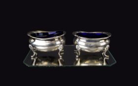 George V Pair of Silver Salts - Complete with Blue Liners, Raised on Splayed Feet. Hallmark