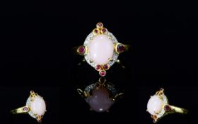 Pink Opal, Ruby and White Zircon Ring, a 2.75ct oval cut cabochon of natural pink opal, set in a