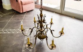 A Vintage Six Branch Metal Chandelier Electric ceiling fitting in aged pewter tone with six ornate
