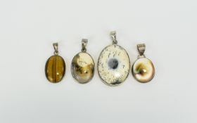 Four Various Natural Gemstone Pendants comprising two dendritic agate ovals, one 2.25 inches high,