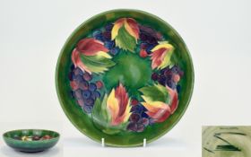 William Moorcroft Signed Large Tubelined Footed Bowl, leaves and berries design on green and blue