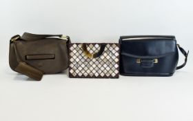 Vintage Bally Handbags Two in total, the first a navy blue leather top handle envelope/flap over