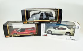Three Collectable Cars. One Black Mini Copper, One Red Ferrari F50 and One White Maserati . All
