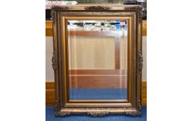 Reproduction Bevelled Glass Mirror Large mirror in aged frame with scroll moulding detail,