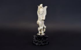 19th Century Carved Ivory Mythical Figure of a Winged Being with a Large Tongue and Large Mallet