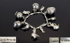 George Jensen Super Quality and Unique Handmade Sterling Silver Charm Bracelet loaded with 11