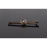 Ladies 15 Carat Gold and Platinum Bar Brooch. set to centre 3 old cut pavee set diamonds not