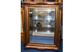 Reproduction Bevelled Glass Mirror Large mirror in aged frame with scroll moulding detail,