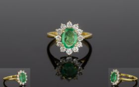 18ct Gold Emerald & Diamond Cluster Ring. The Oval Emerald Surrounded by 13 Diamonds.