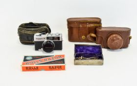 A Collection Of Vintage Cameras And Miscellaneous Items To include, Spartus 35F Model 400 35mm