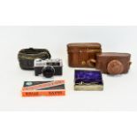 A Collection Of Vintage Cameras And Miscellaneous Items To include, Spartus 35F Model 400 35mm