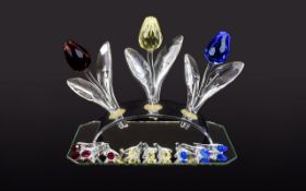 Three Swarovski Display Tulips 1. Yellow Tulip code number 657355 2. Tulip with a smooth Clear