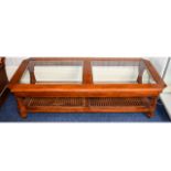 Coffee Table Large low rectangular coffee table in dark wood with bevelled glass top and woven