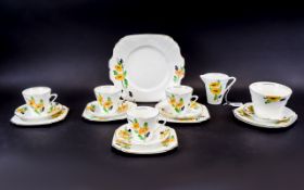 Retro Part Teaset, yellow, black and green floral decoration on white ground comprising 4 cups,